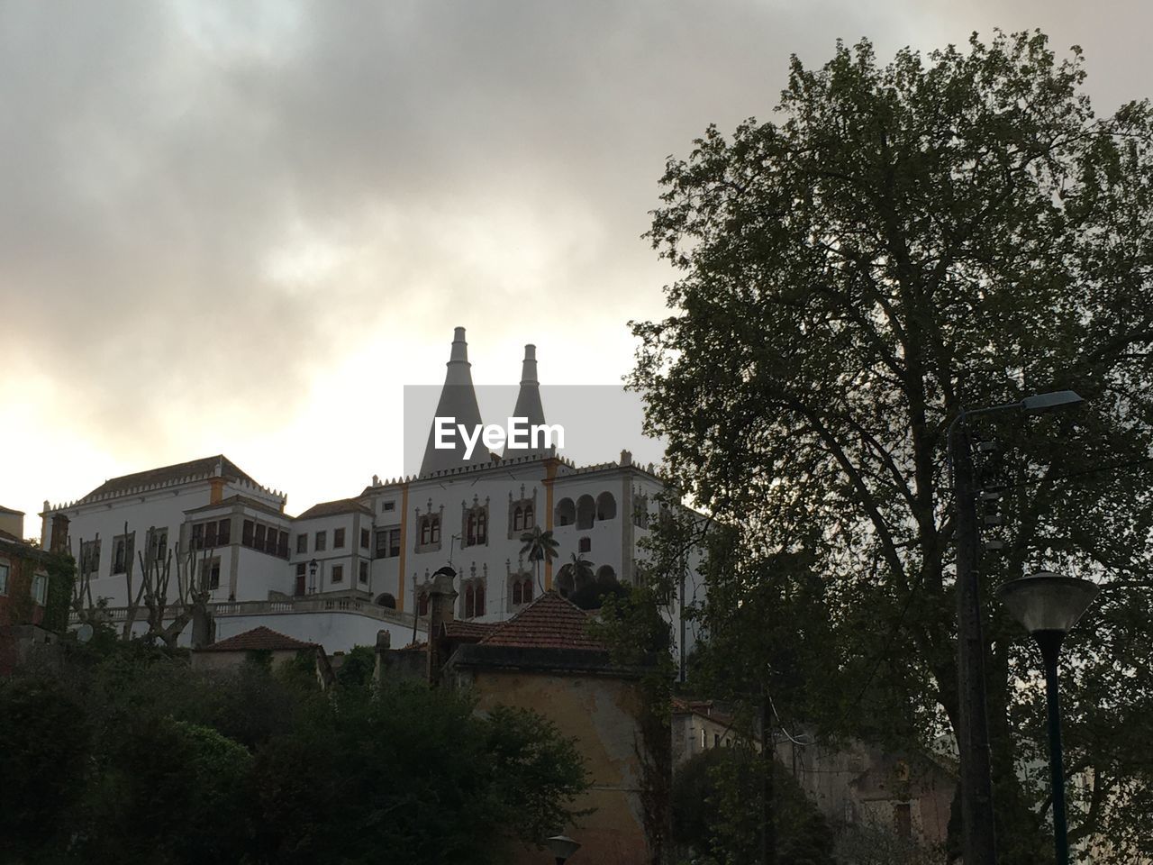 VIEW OF CLOUDY SKY OVER BUILDINGS