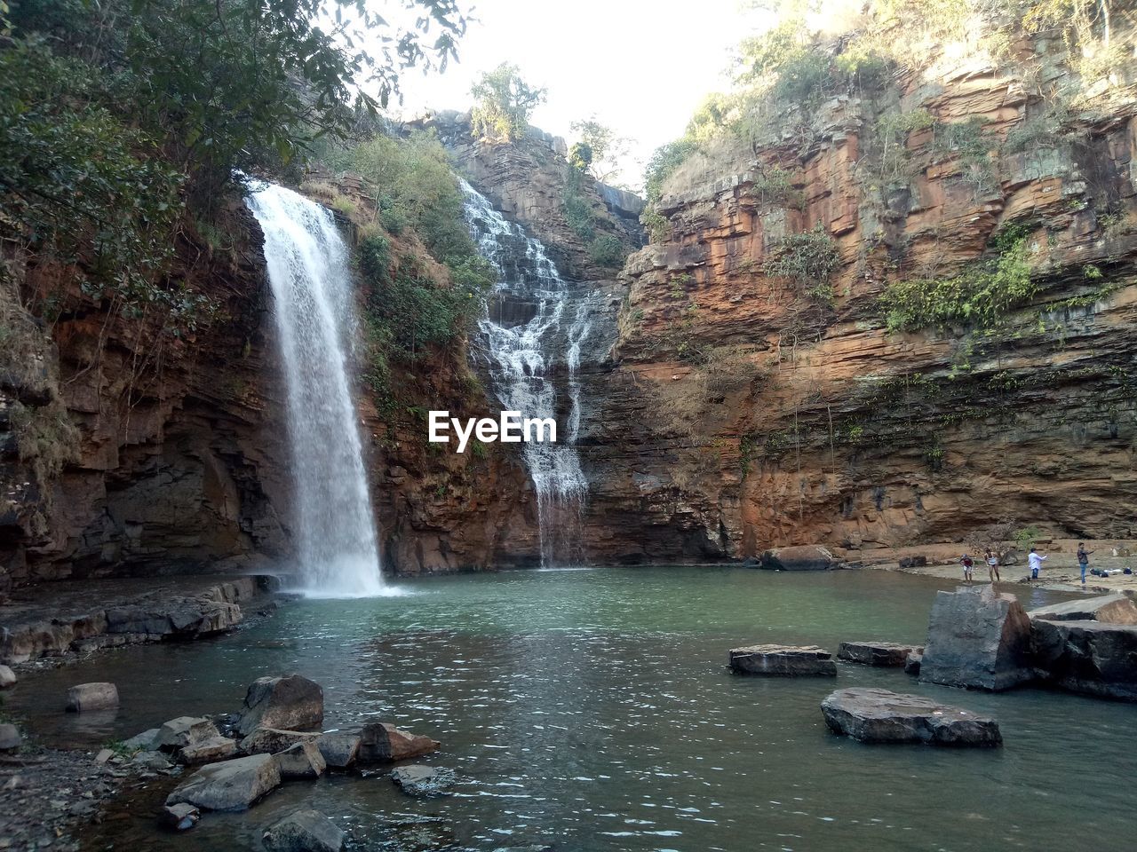 VIEW OF WATERFALL AGAINST SKY