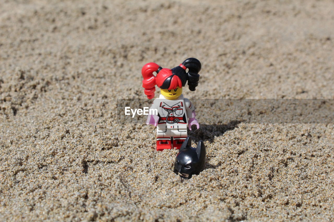 TOY CAR ON SAND