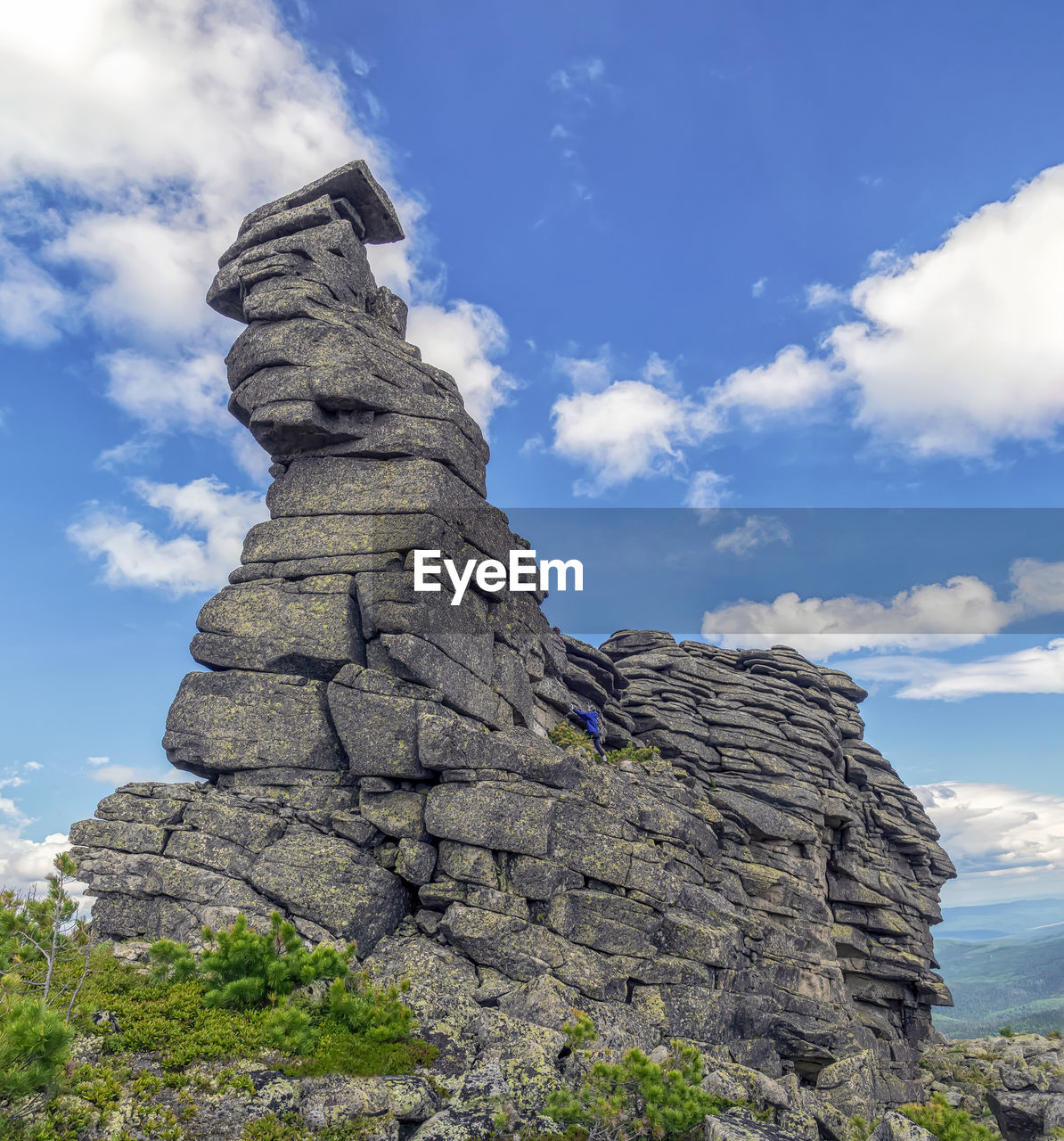sky, cloud, rock, mountain, nature, scenics - nature, beauty in nature, environment, rock formation, landscape, travel destinations, geology, land, cliff, no people, travel, non-urban scene, mountain range, day, plant, outdoors, tranquility, physical geography, terrain, low angle view, blue, tranquil scene, landmark, formation, tourism, tree, eroded, adventure, ridge