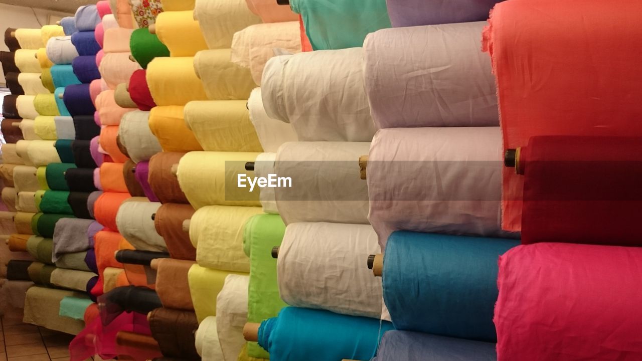 Close-up of colorful textiles for sale in store