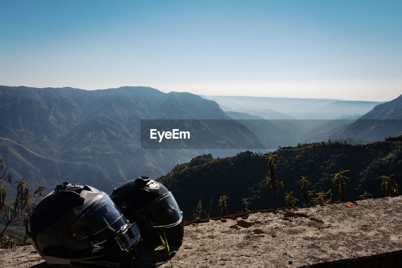 Helmet at mountain top with misty mountain background