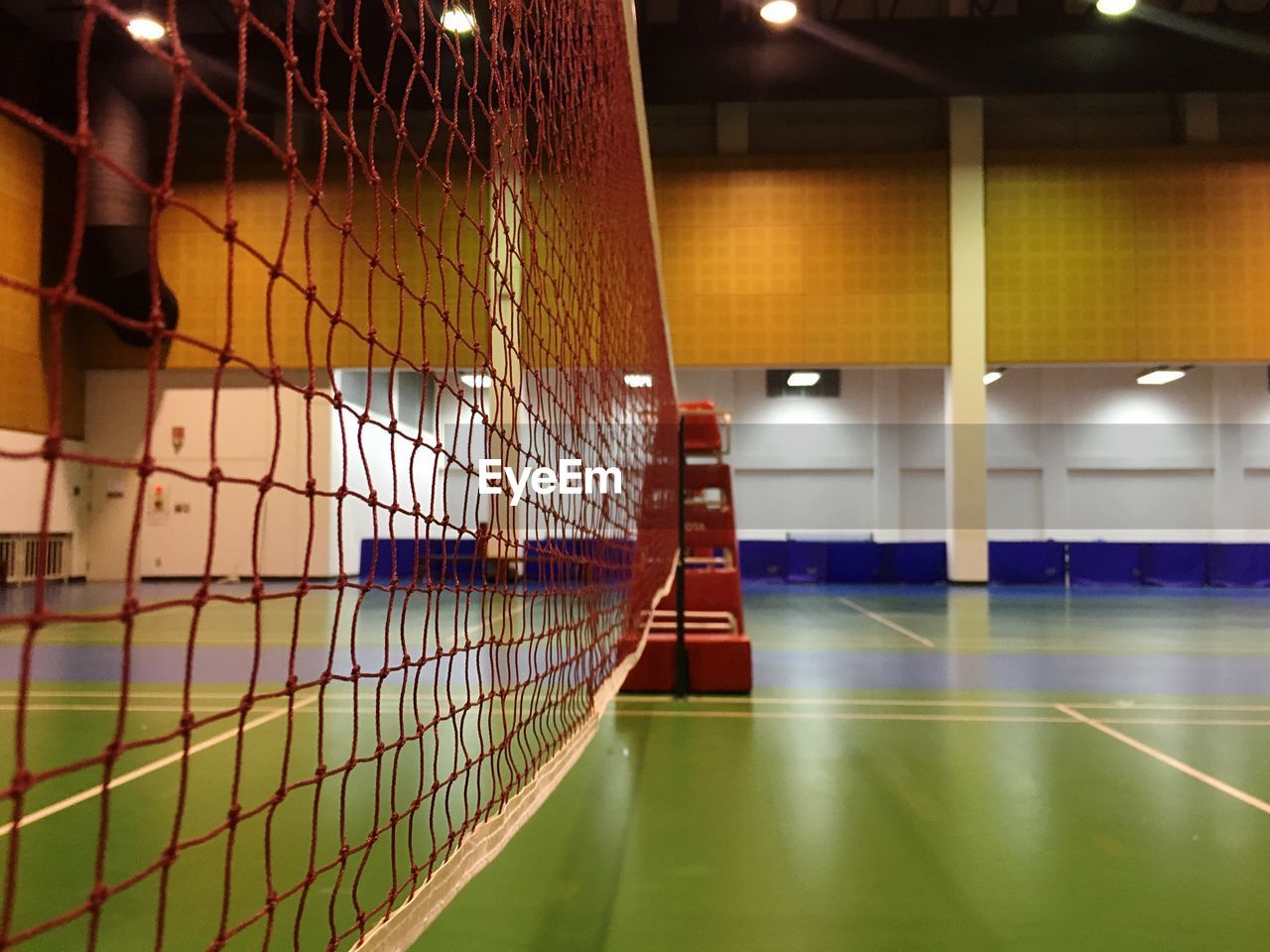 Net at illuminated badminton court