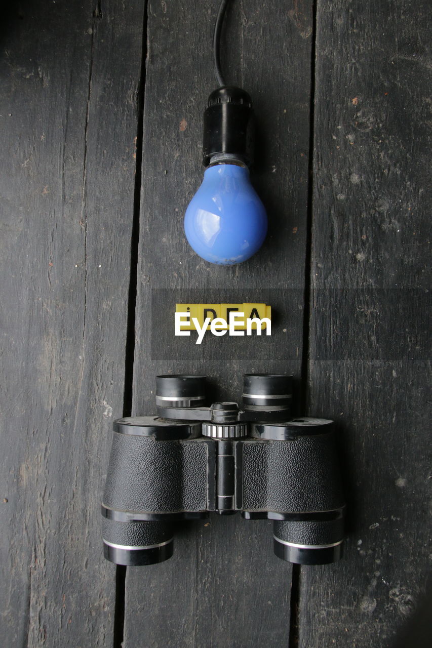 high angle view of camera on wooden table