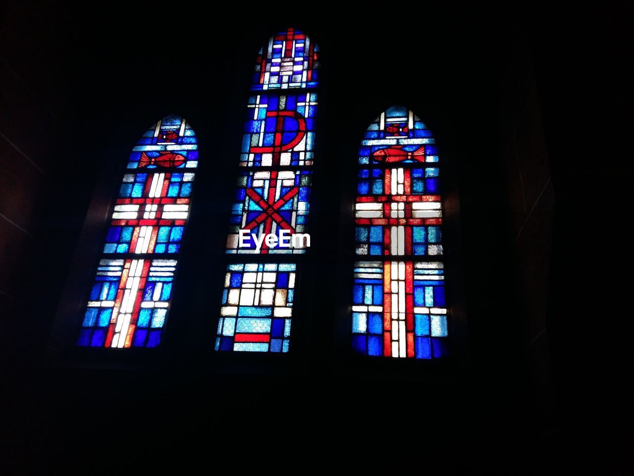 Low angle view of stained glass windows in church