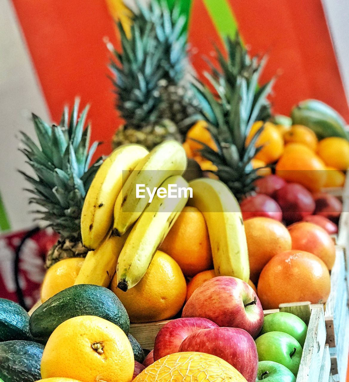Close-up of colorful abundant fruits in container
