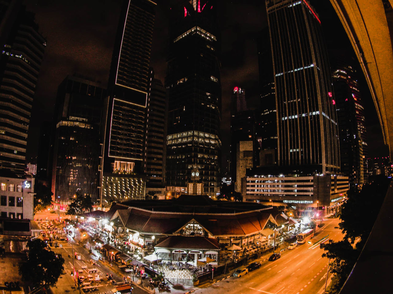 LIGHT TRAILS ON CITY STREET AT NIGHT