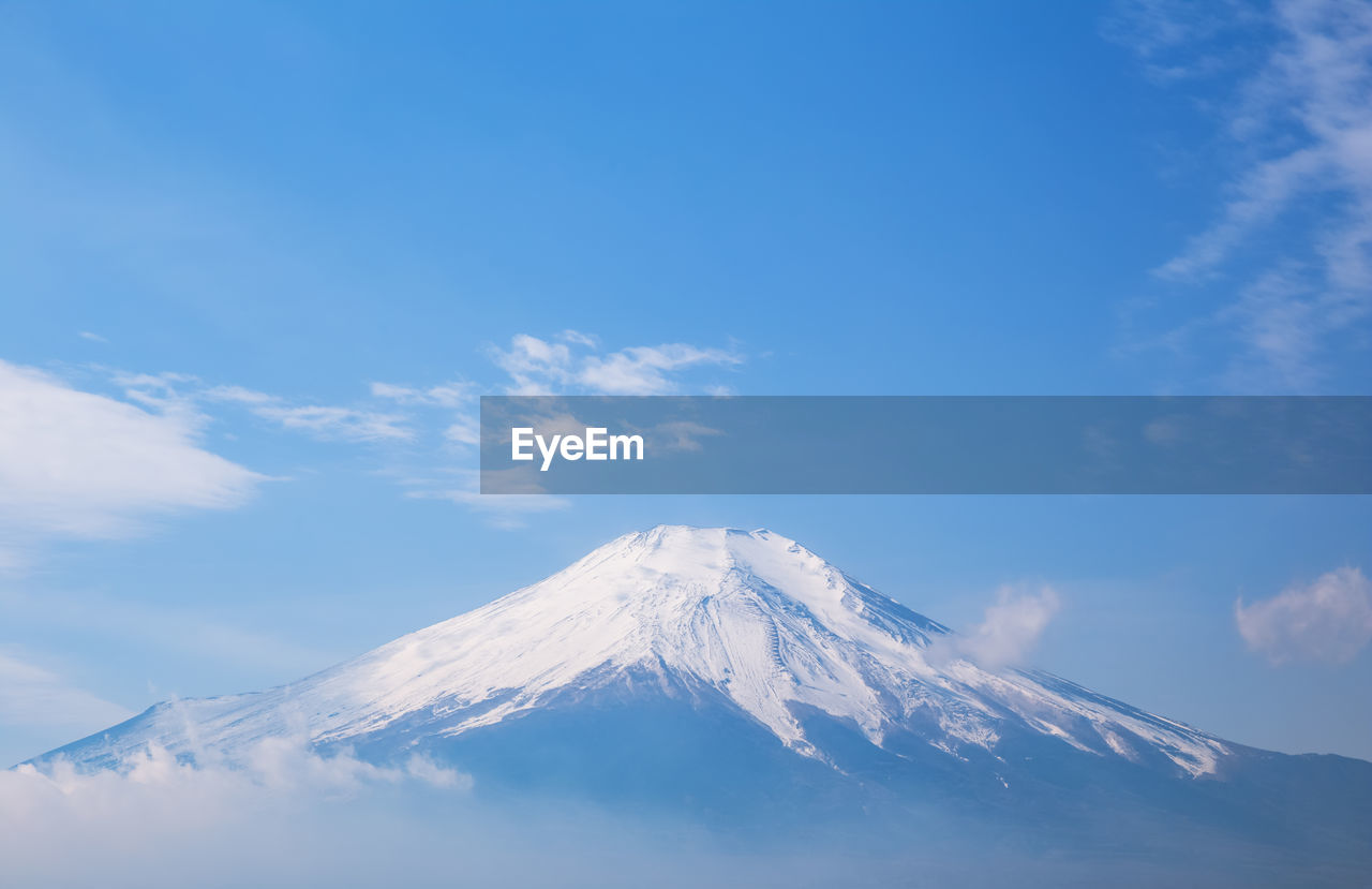 Closeup top of fuji mountain with blue sky