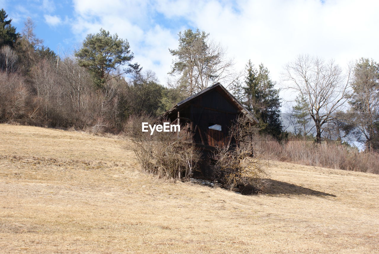 Built structure on landscape against sky