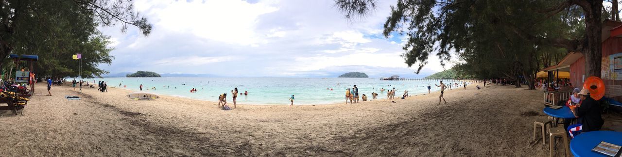 PANORAMIC VIEW OF PEOPLE AT BEACH