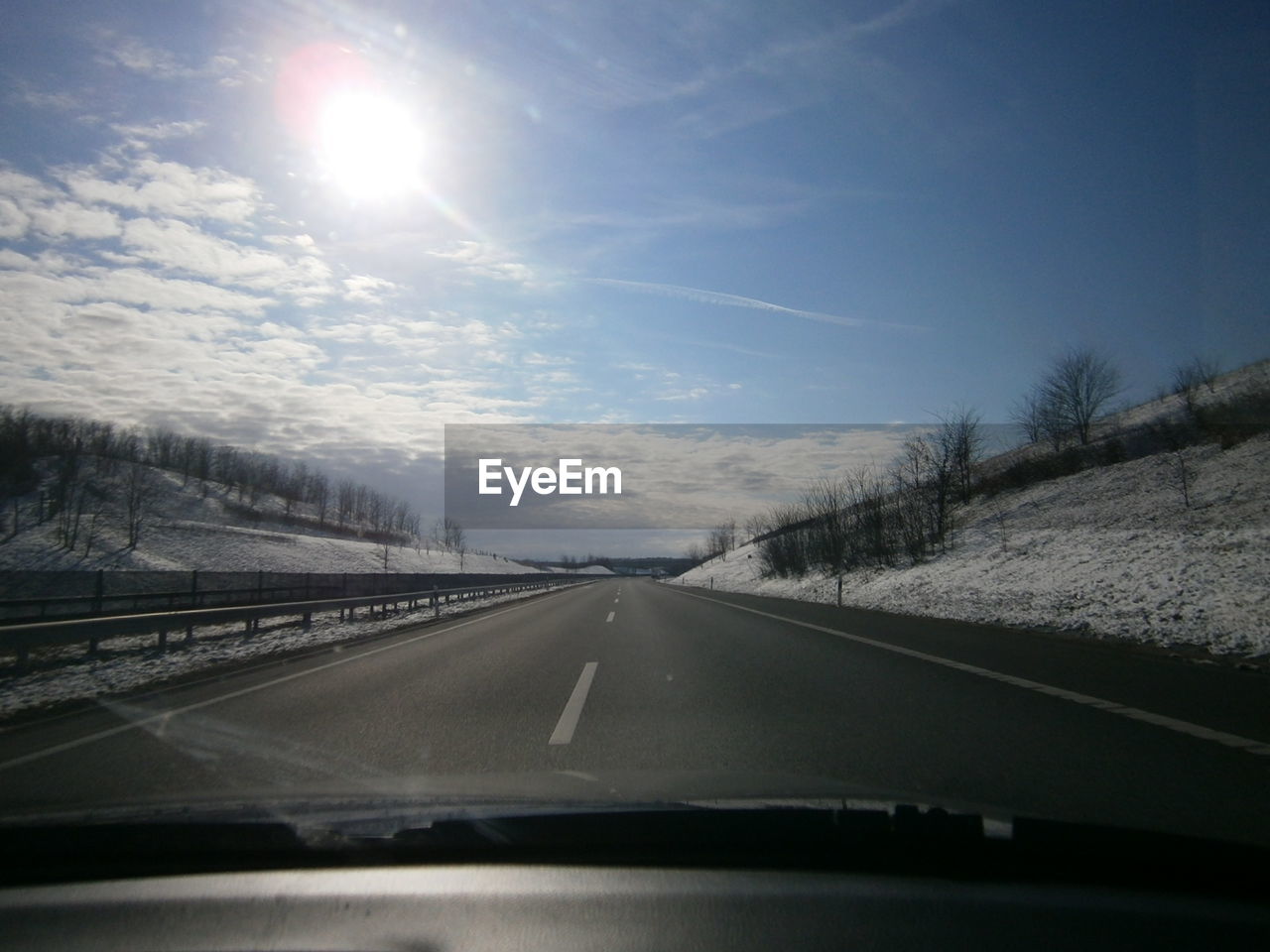 Road seen through car windshield