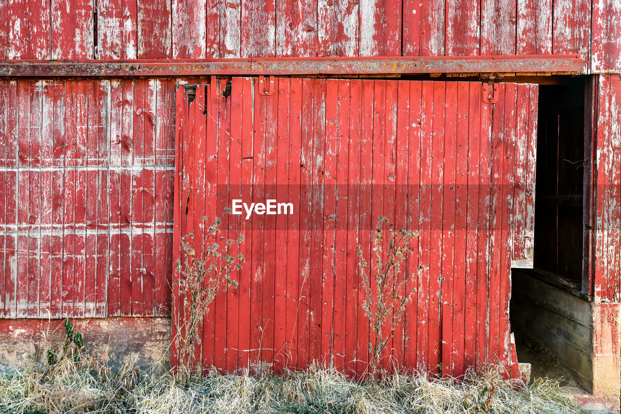 Closed weathered wooden barn door