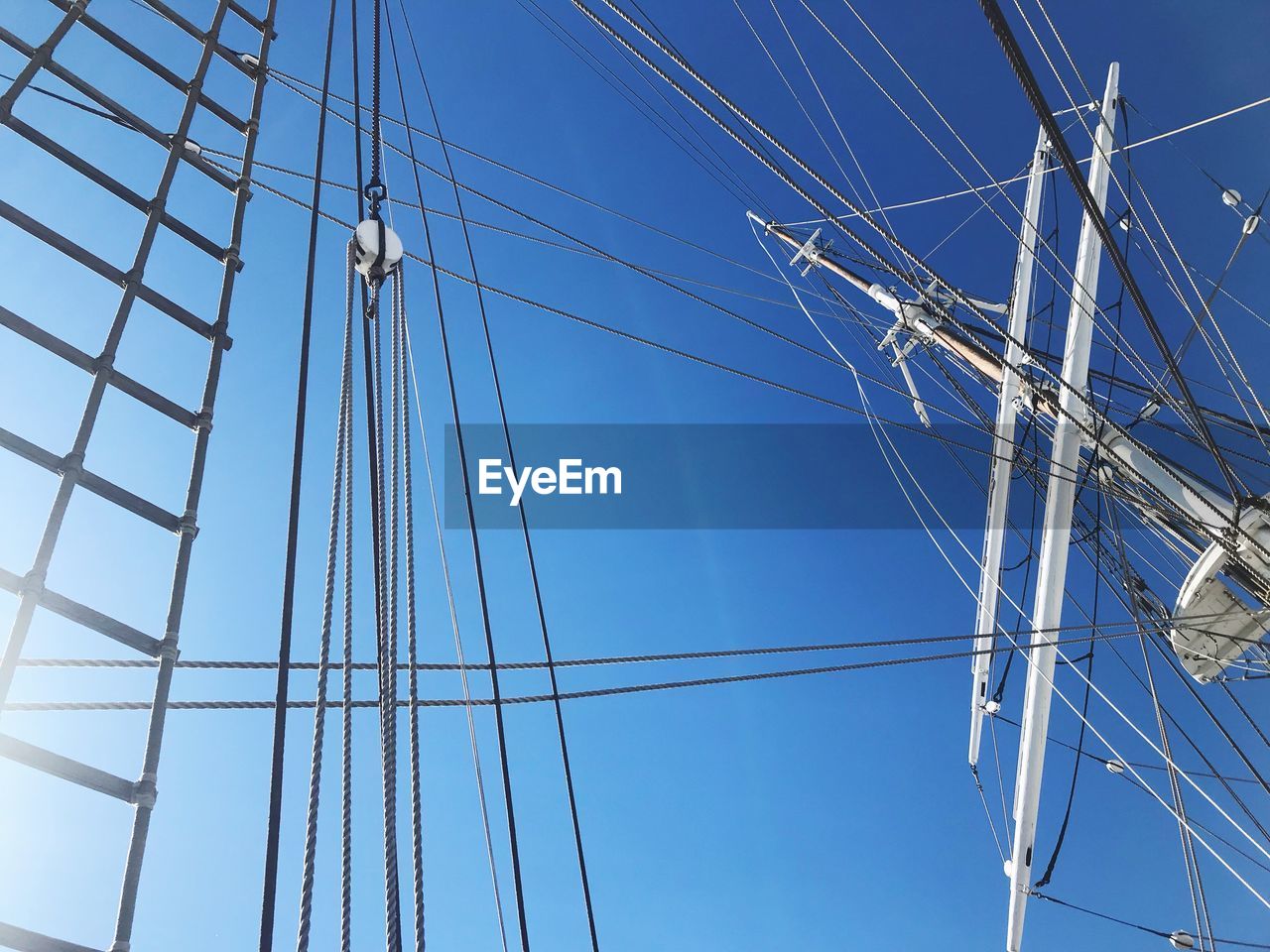 Low angle view of ship against blue sky