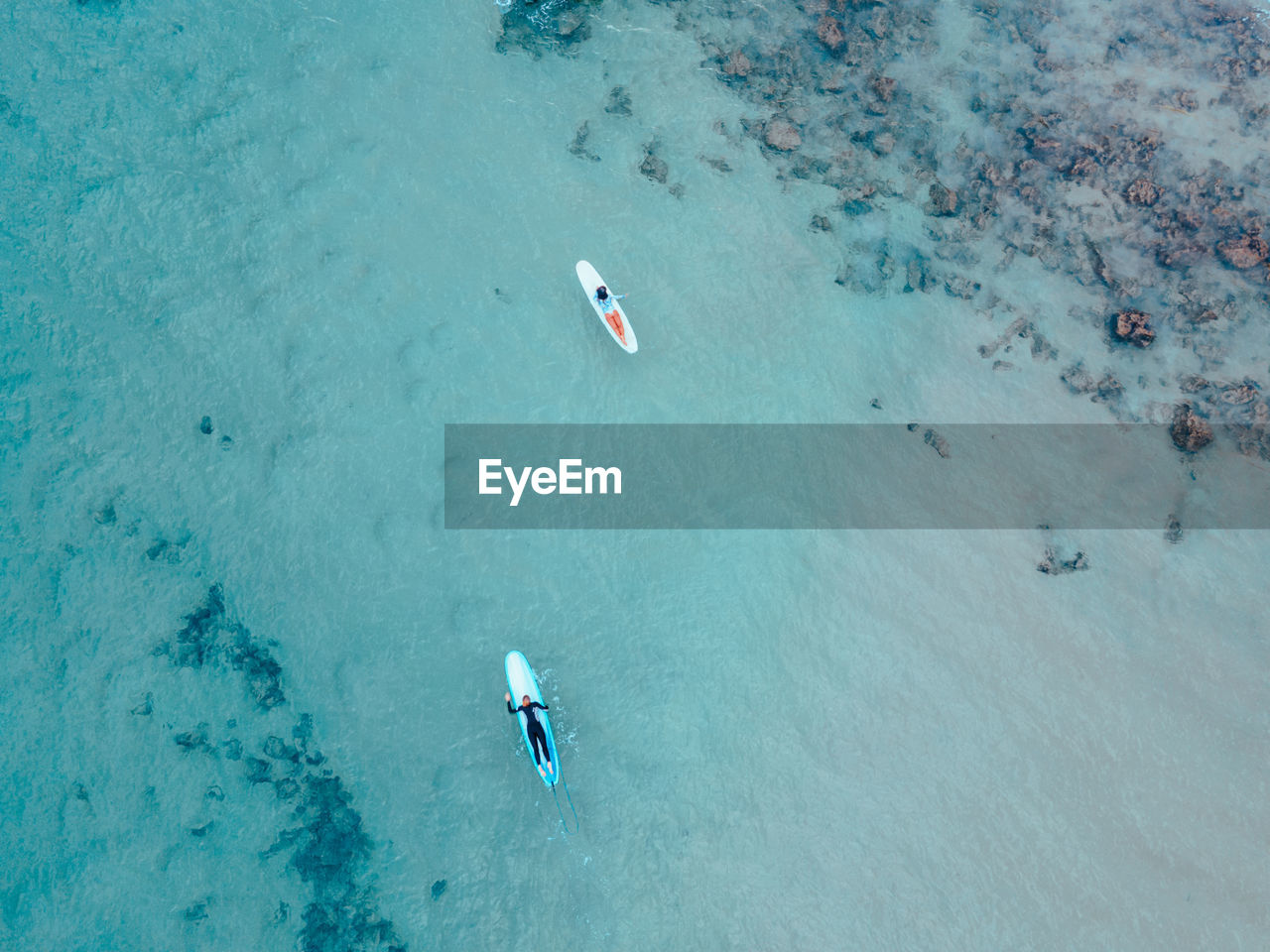 High angle view of people swimming in sea