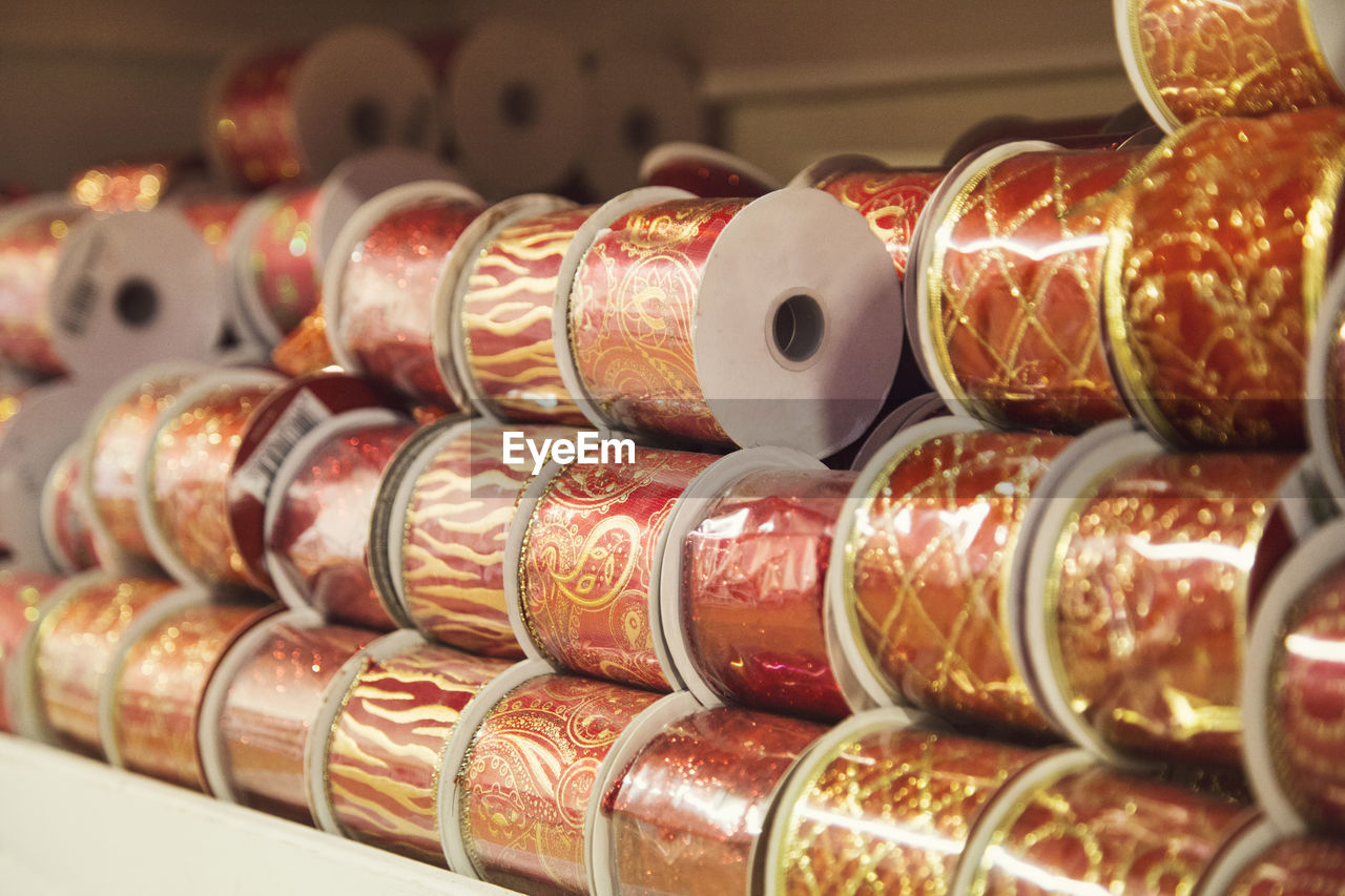 Close-up of rolled up ribbons at shop