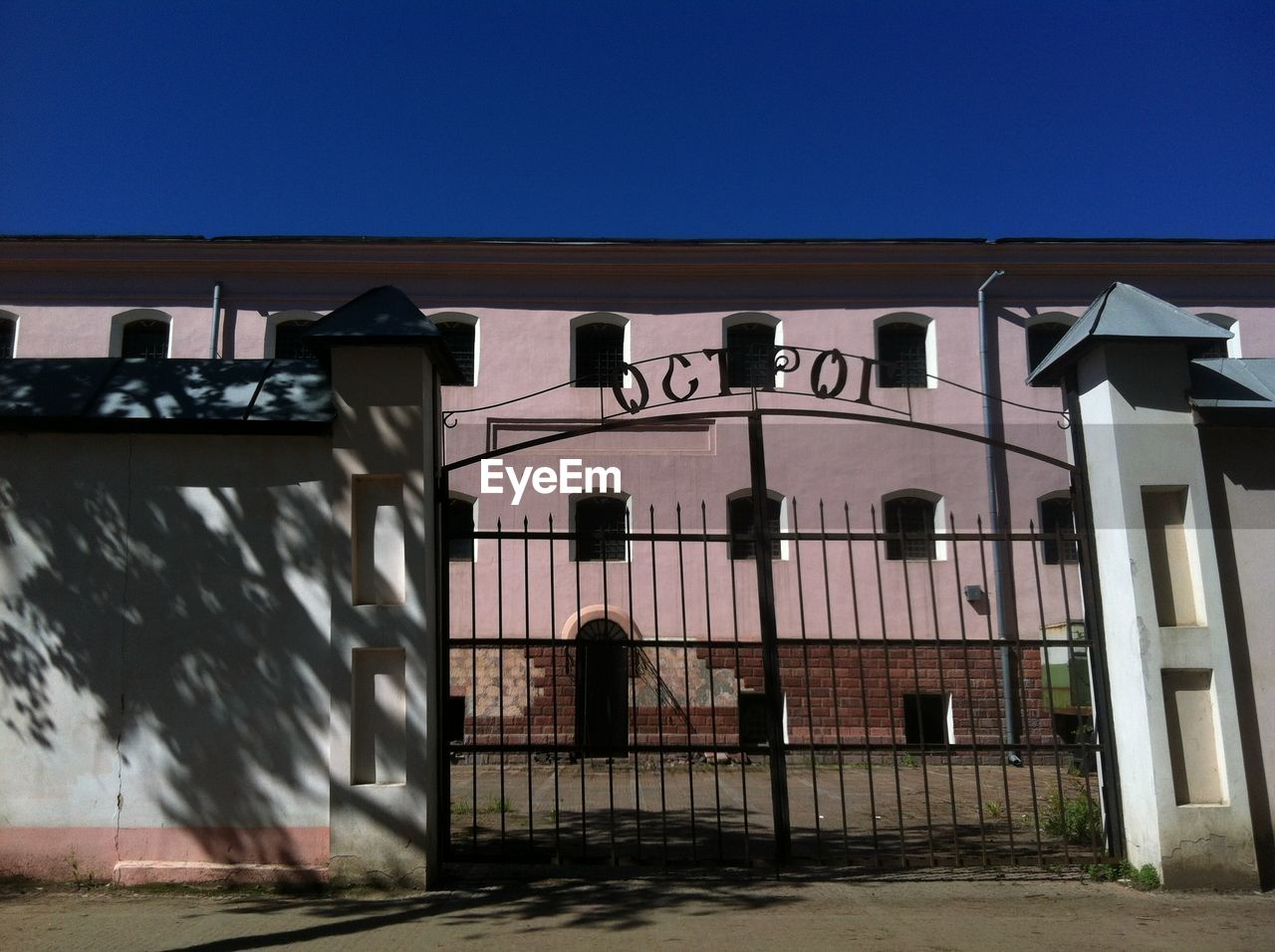 ENTRANCE OF BUILDING AGAINST BLUE SKY