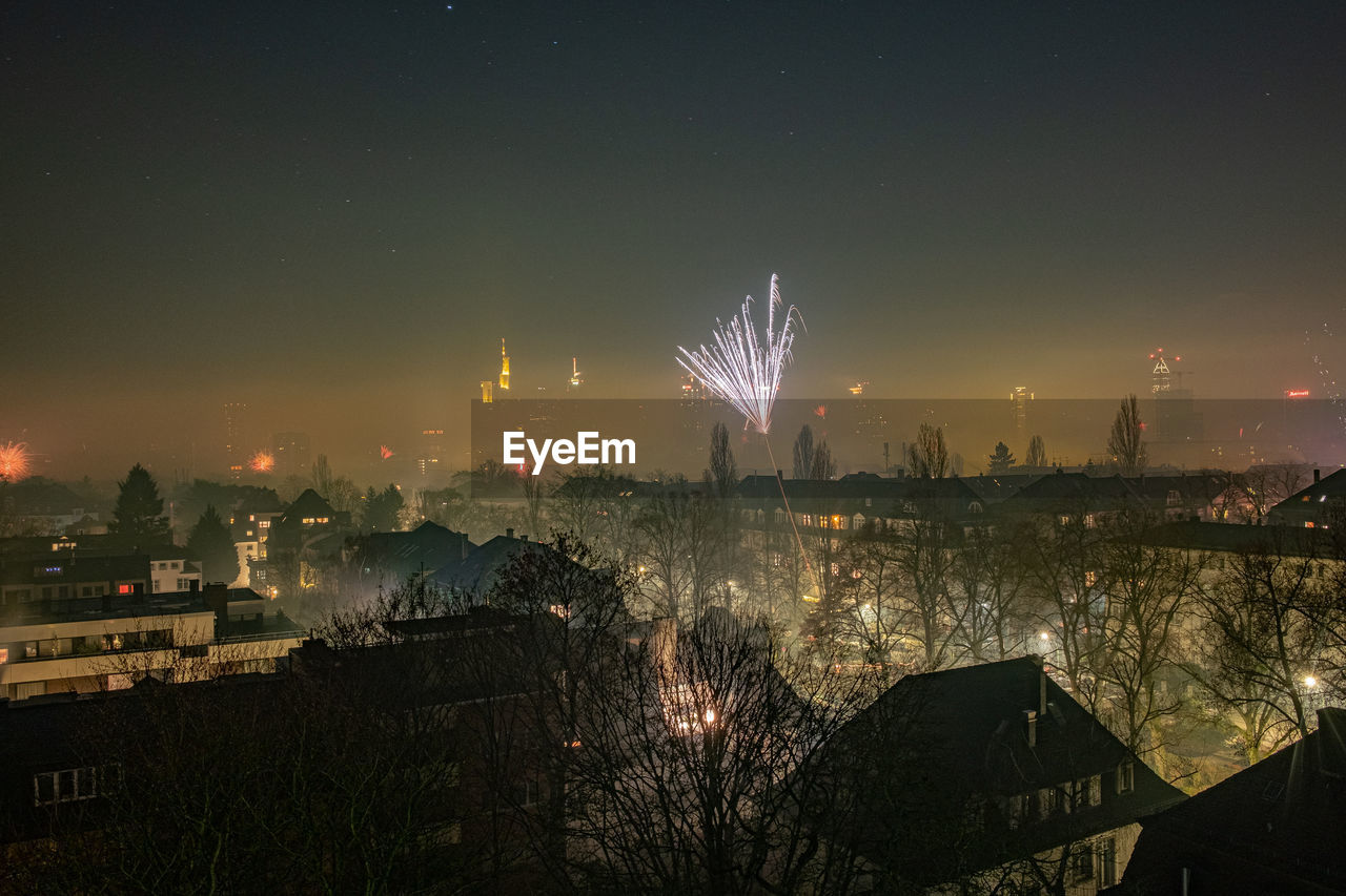 The frankfurt skyline with firework displays at new years eve