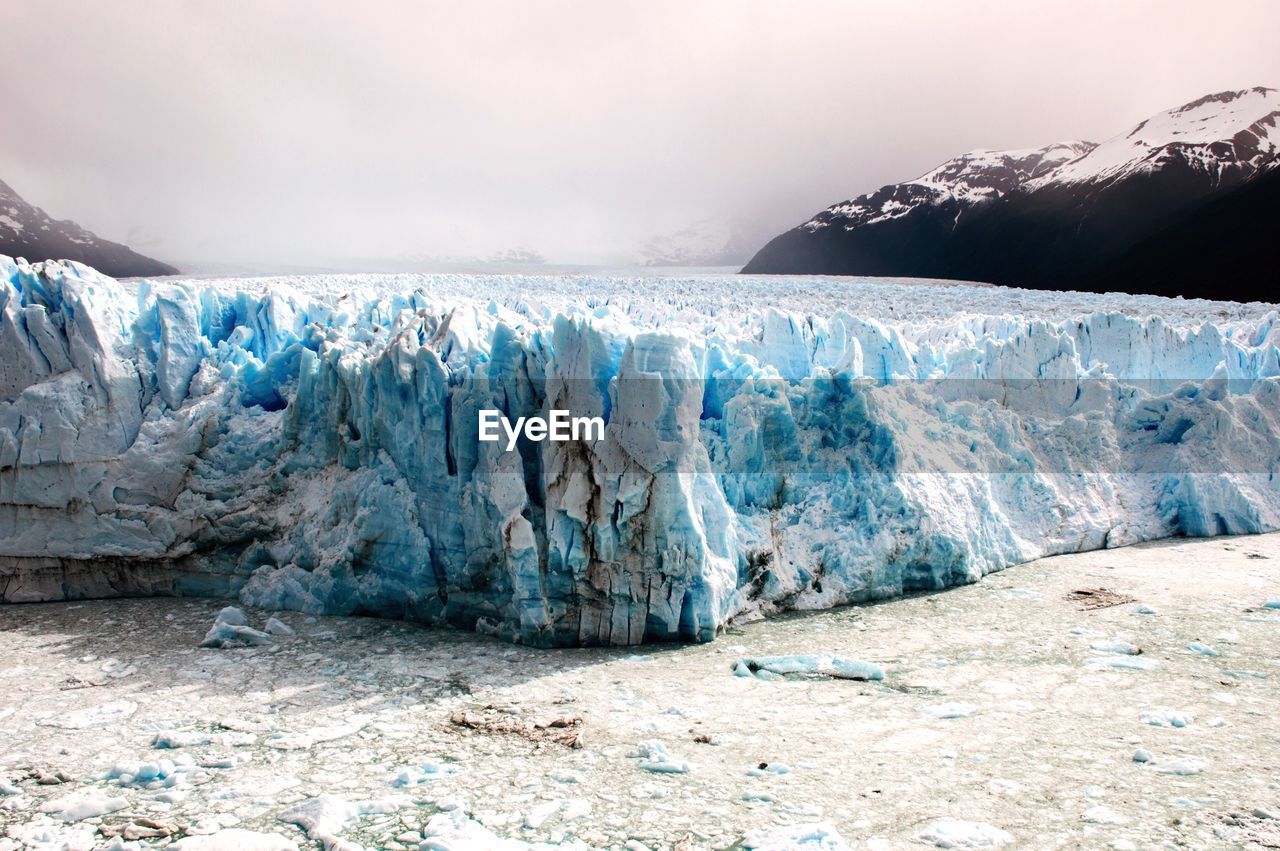 Scenic view of glaciers against sky