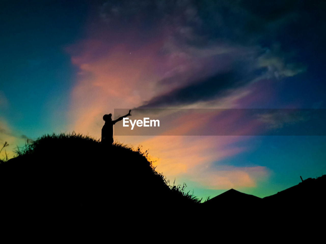 SILHOUETTE OF LANDSCAPE AT SUNSET