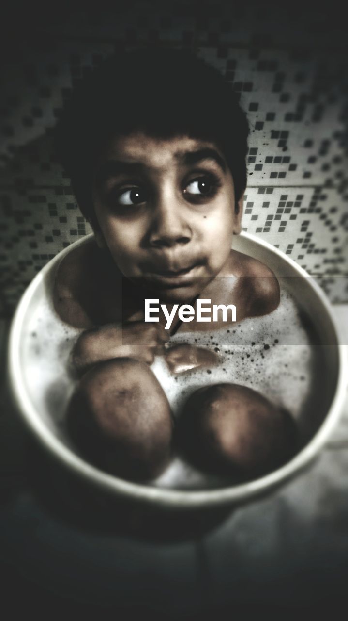 Portrait of boy in bowl