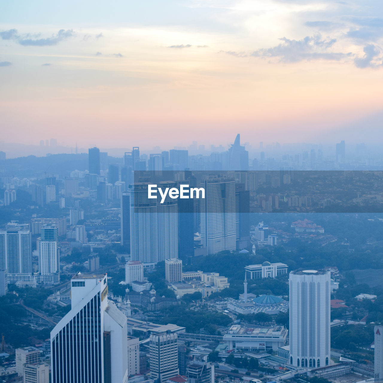 High angle view of modern buildings in city against sky