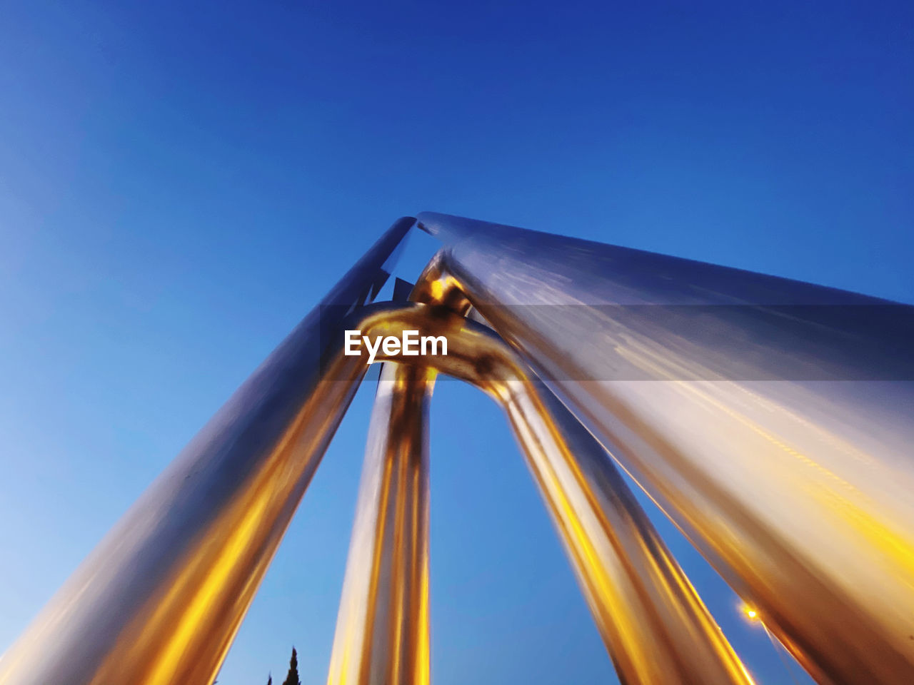 LOW ANGLE VIEW OF METAL STRUCTURE AGAINST SKY