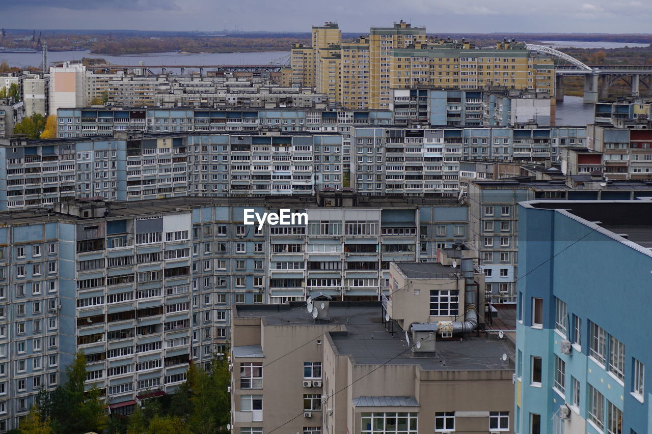 Metropolis. large apartment buildings in the city by the river.