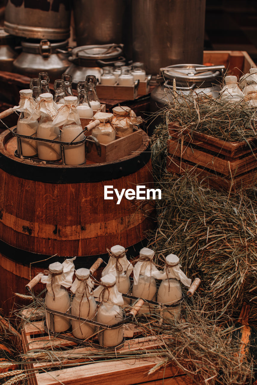 Milk bottles mockups on the hay. autumn farm fair market. rustic style. healthy natural products