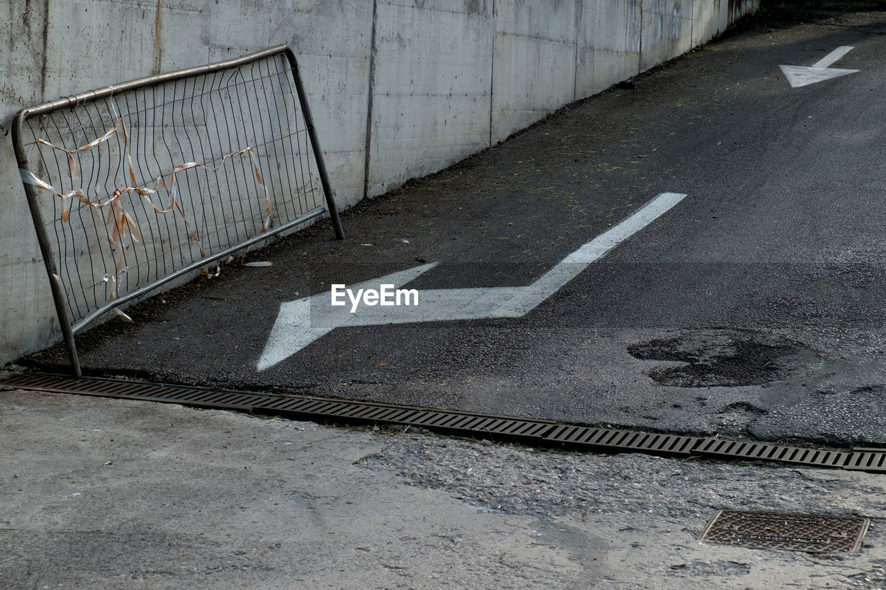 High angle view of arrow symbols on road