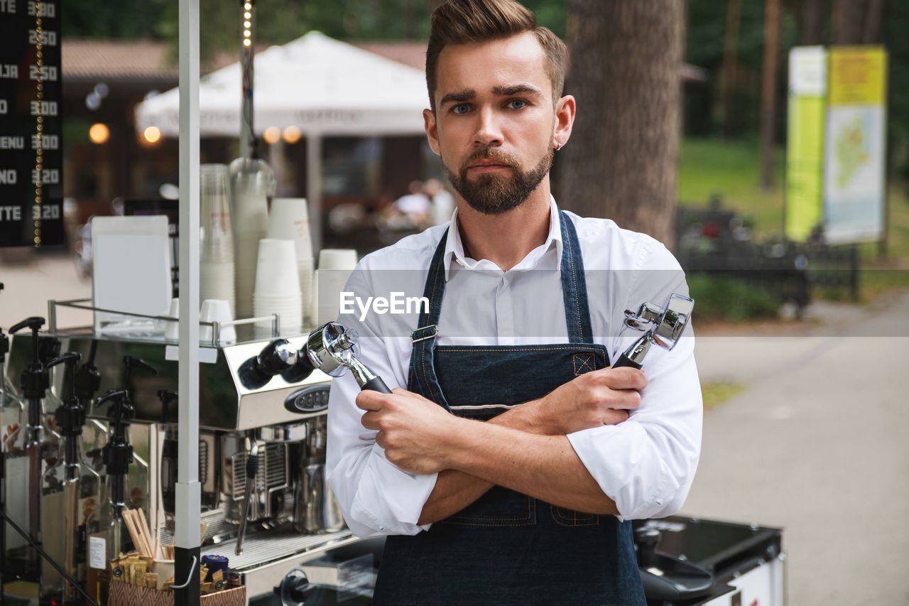 portrait of young man using mobile phone