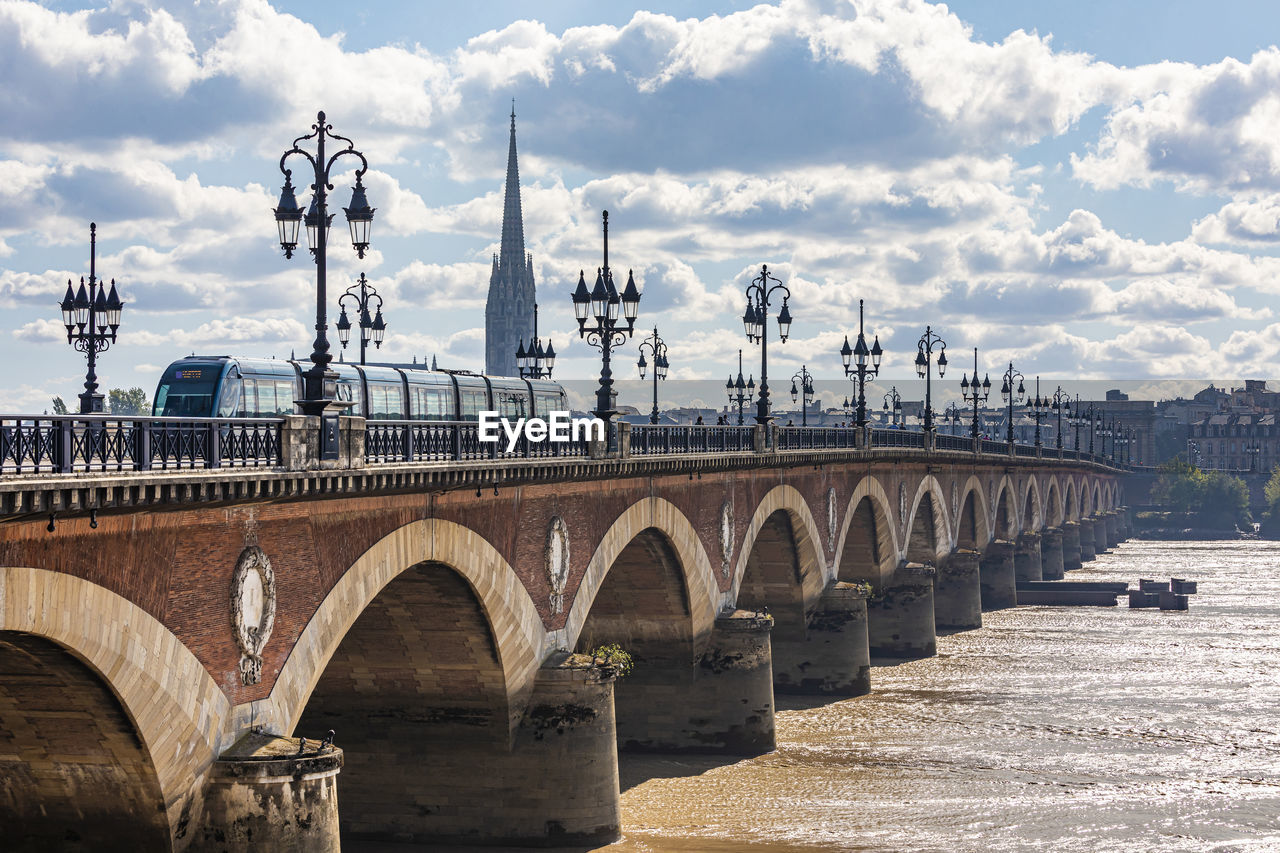 France, nouvelle-aquitaine, bordeaux, pont de pierre stretching over garonne river