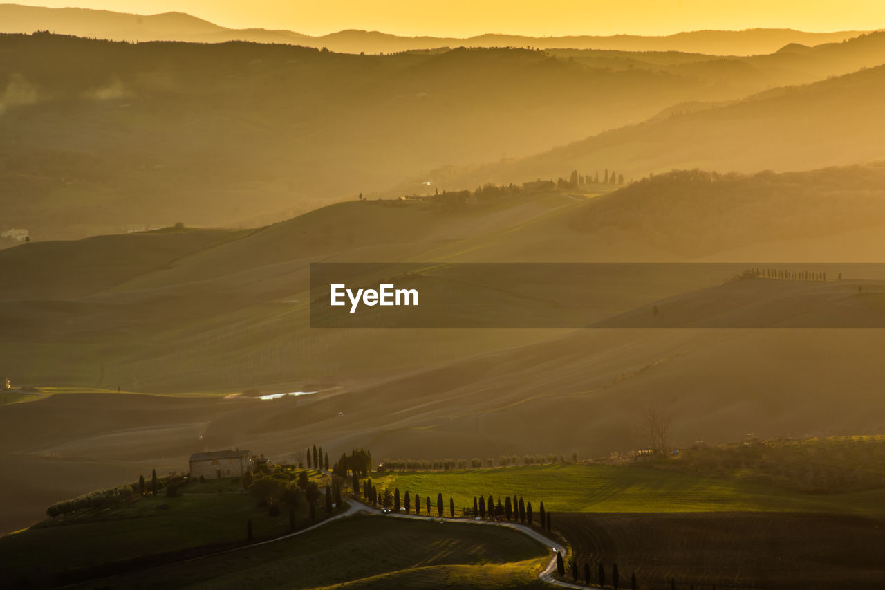 Scenic view of landscape against sky during sunset