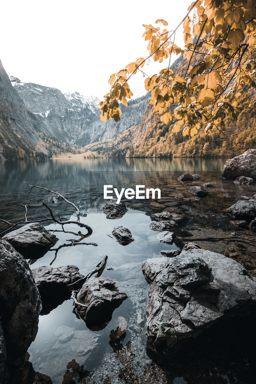 Scenic view of lake against sky during winter