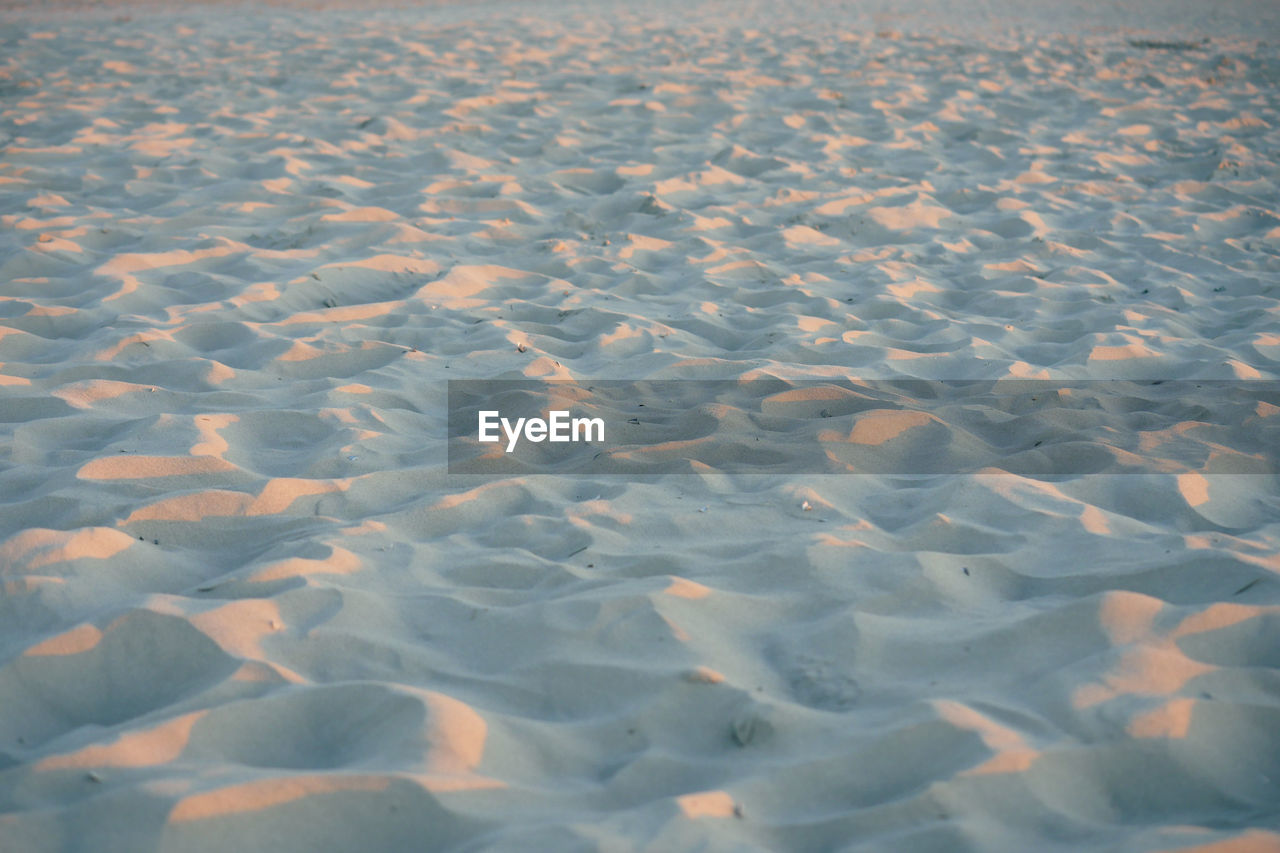 natural environment, reflection, ice, snow, no people, nature, land, tranquility, sea, beauty in nature, scenics - nature, landscape, day, backgrounds, tundra, water, environment, ocean, pattern, tranquil scene, full frame, sunlight, sand, outdoors, freezing, horizon, high angle view, winter, sky