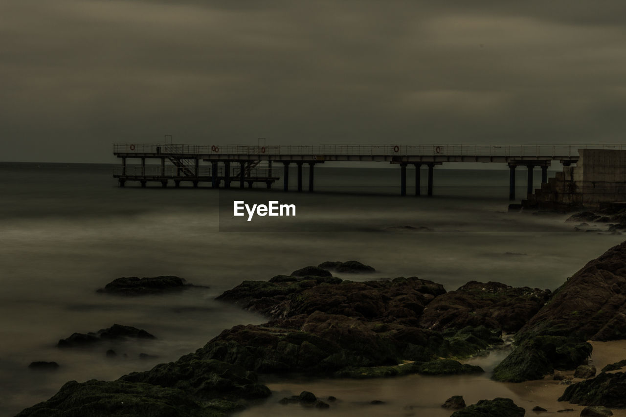 Scenic view of sea against sky at sunset