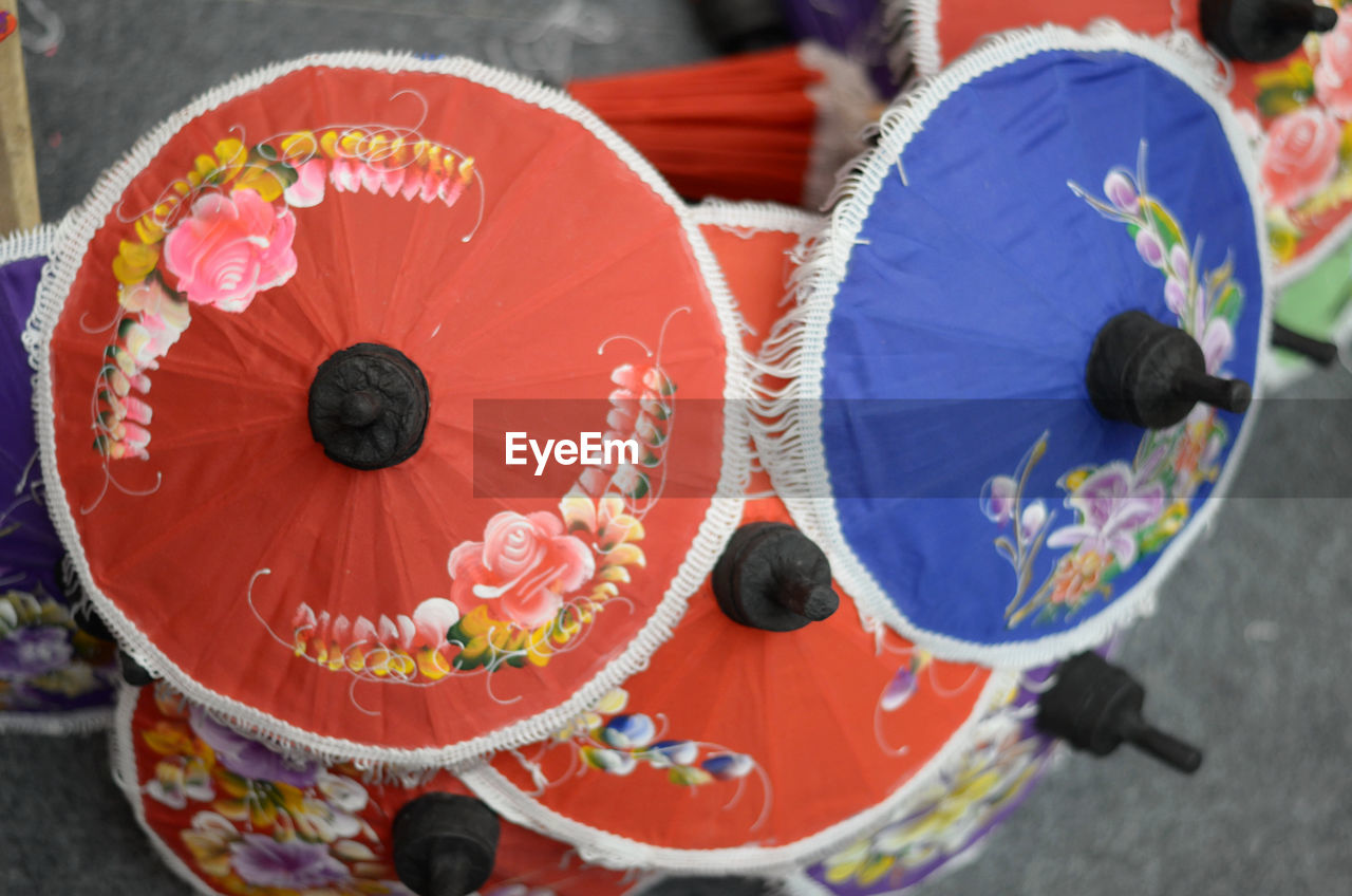 HIGH ANGLE VIEW OF MULTI COLORED DECORATION ON STREET