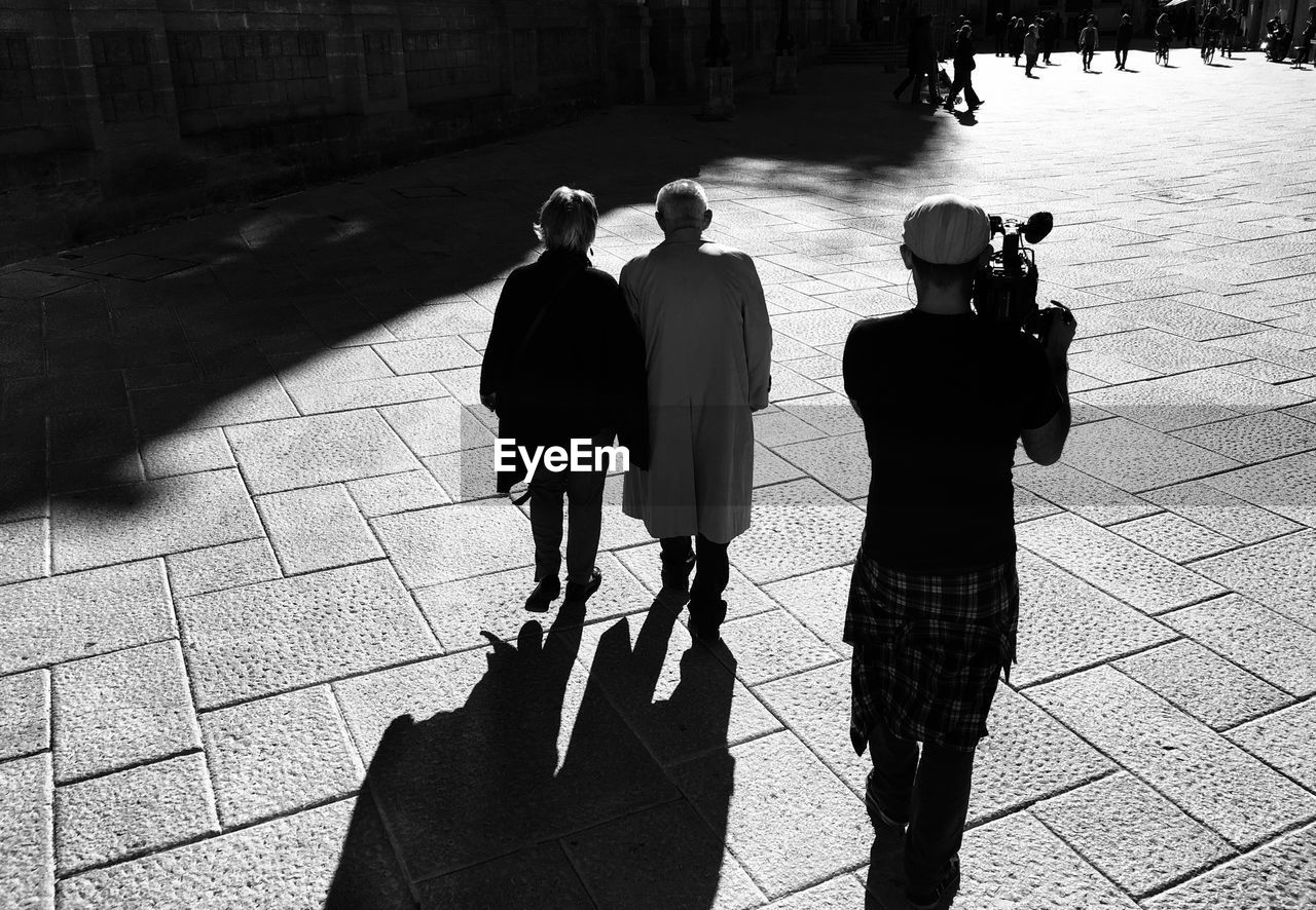 Man with video camera outdoors 