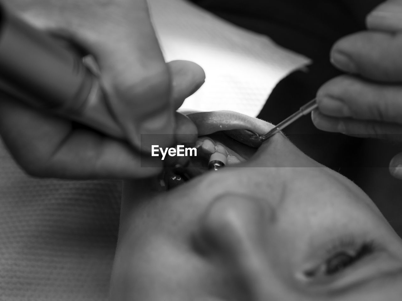 Close-up of dentist examining teeth of boy at clinic