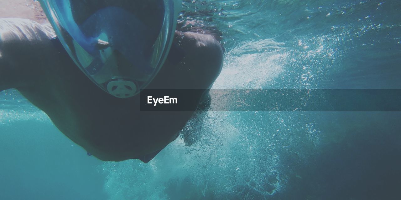 Face of diver after jumping into sea with mask 