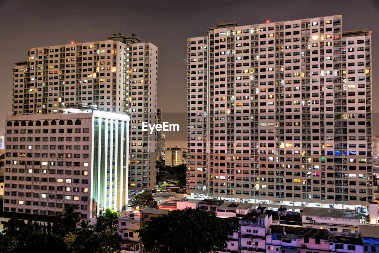 High angle view of buildings in city at night