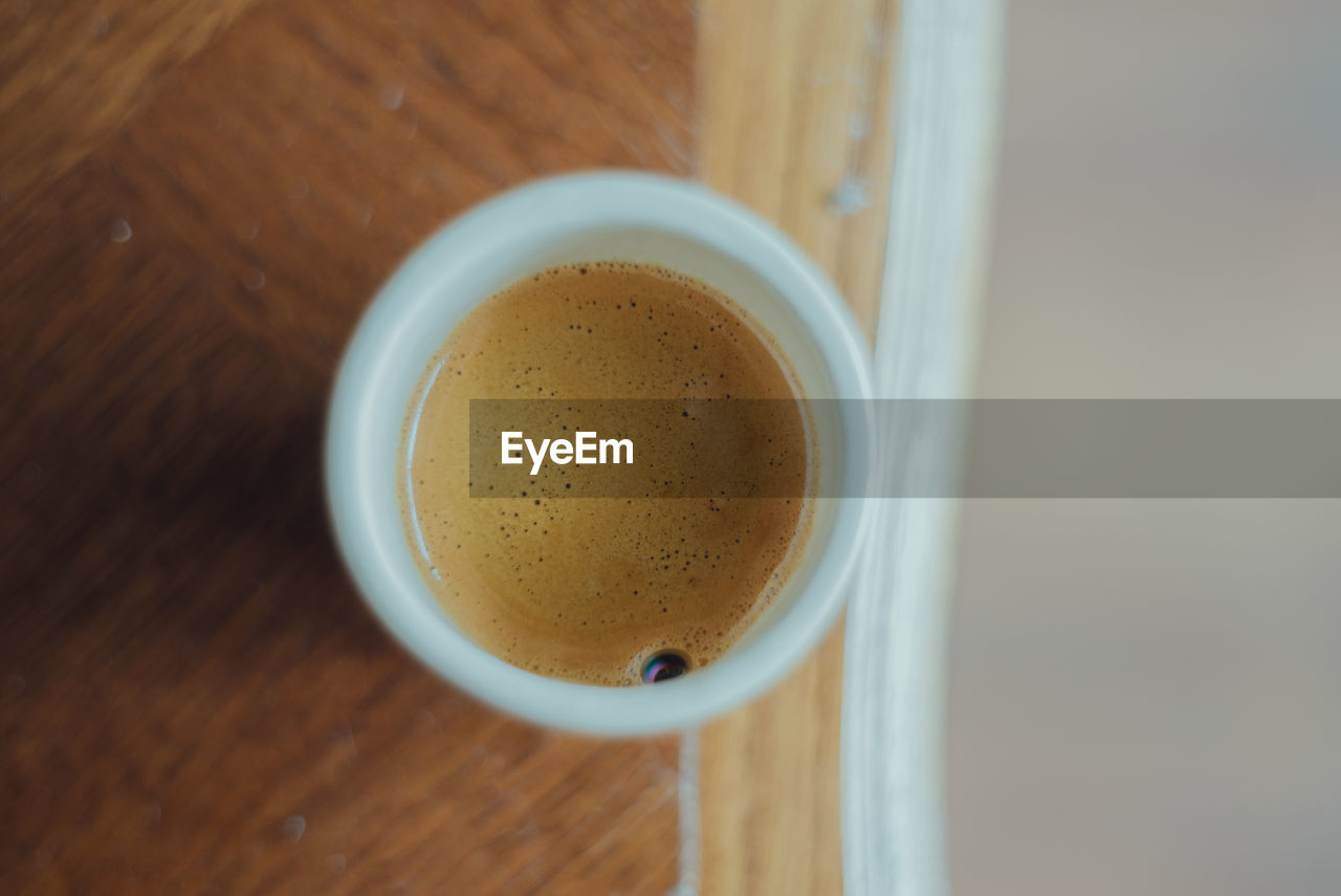 food and drink, drink, refreshment, coffee, cup, mug, table, coffee cup, still life, wood, indoors, high angle view, directly above, freshness, no people, close-up, hot drink, frothy drink, latte, food