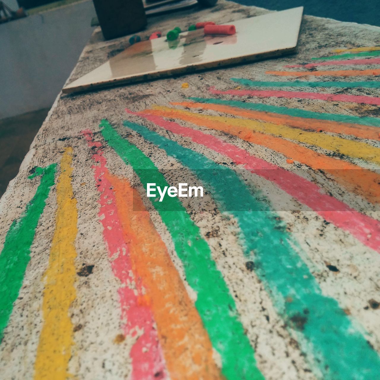 Close-up of colorful chalk drawing on table
