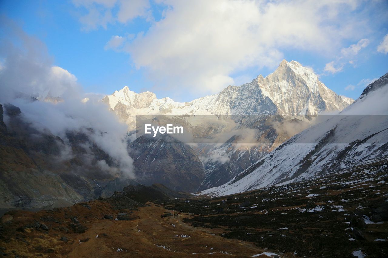 Idyllic shot of snowcapped mountains against sky