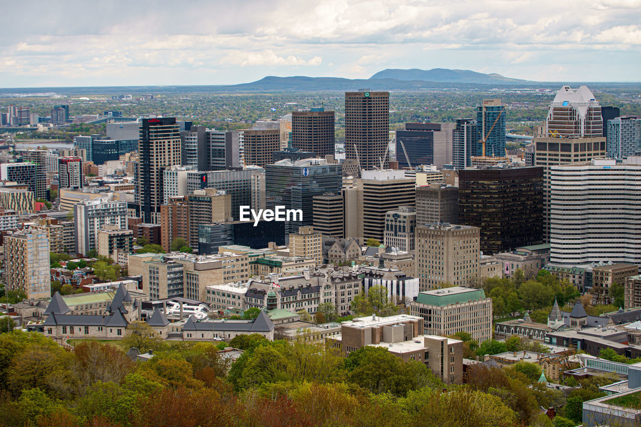 High angle view of buildings in city against sky