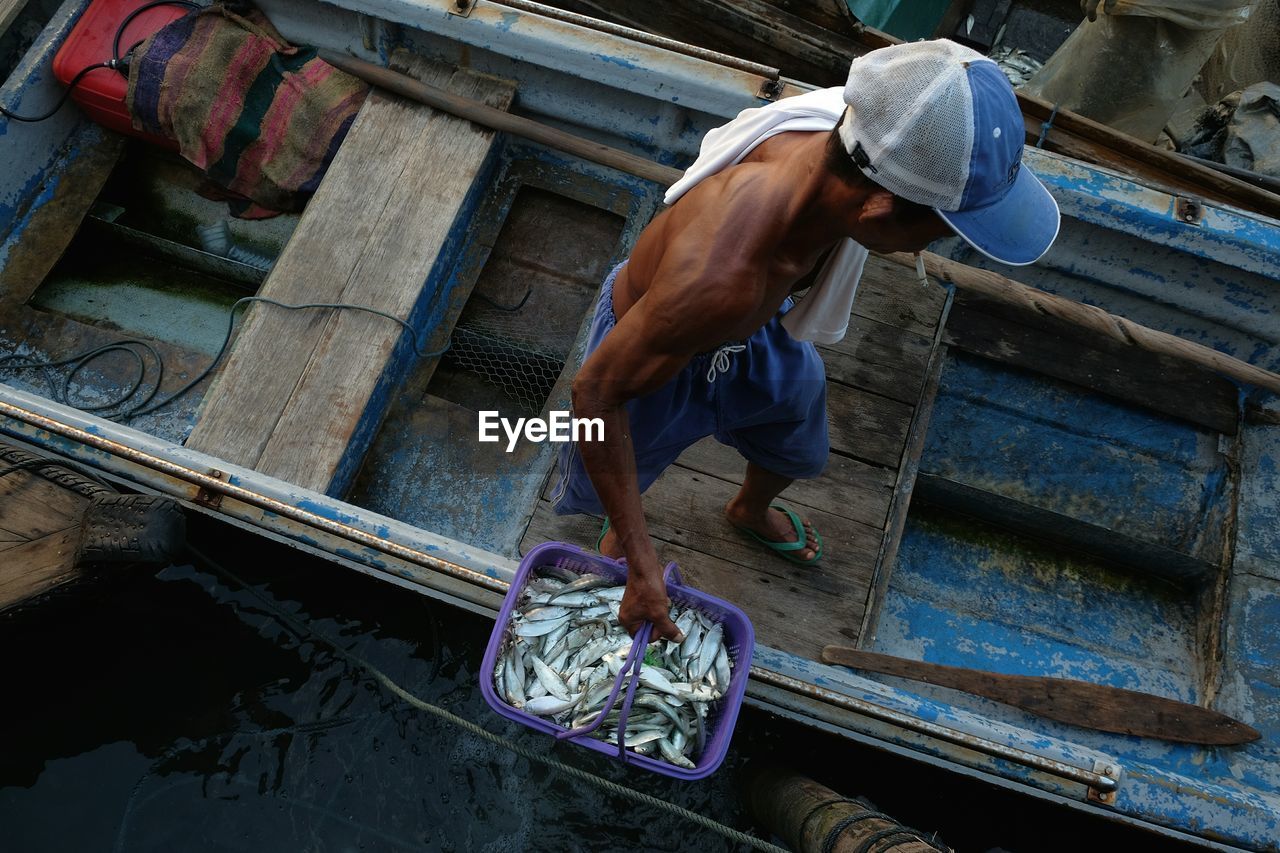 High angle view of fisherman on boat