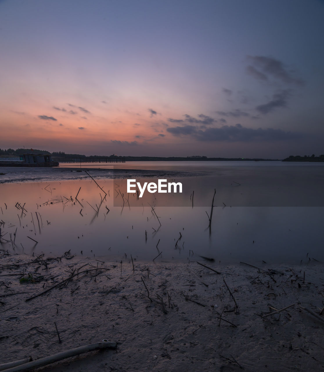 Scenic view of sea against sky at sunset