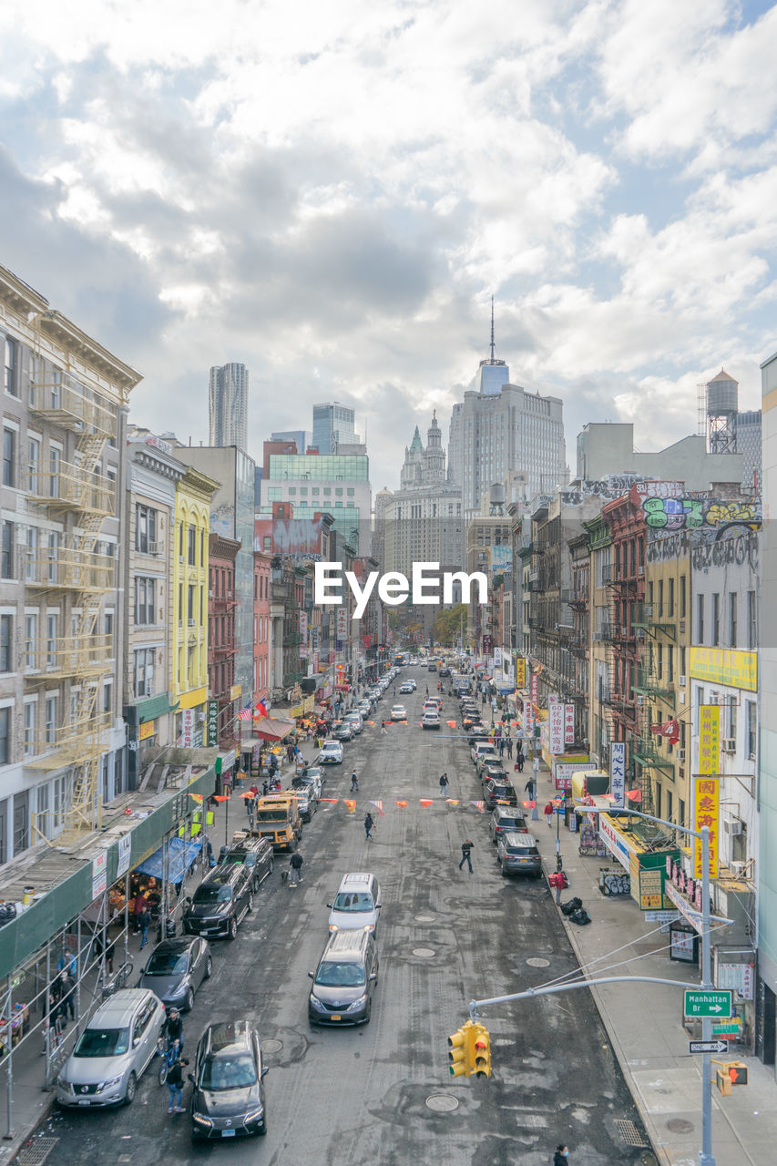 High angle view of city street in china town, new york. buildings, cars and traffic lights,