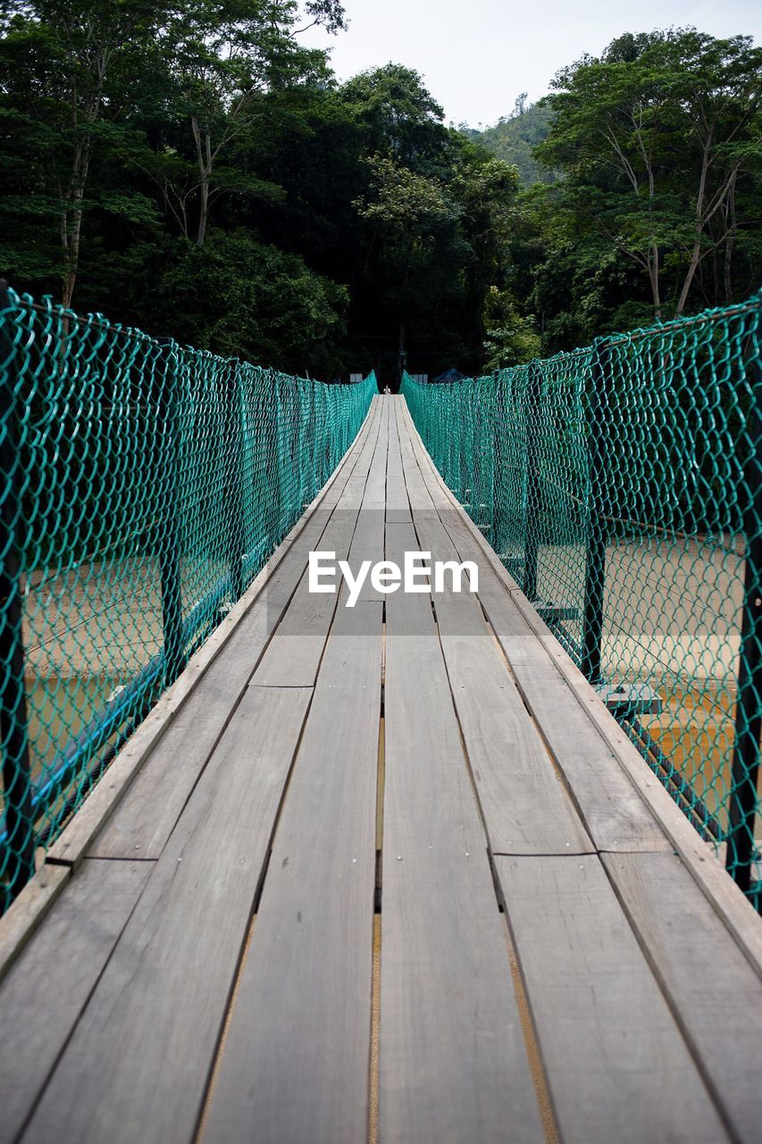 Empty footbridge over river