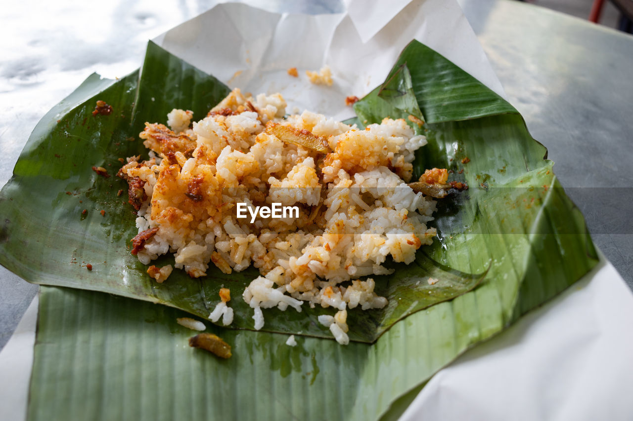 food and drink, food, healthy eating, dish, freshness, wellbeing, banana leaf, asian food, cuisine, rice - food staple, produce, no people, vegetable, leaf, seafood, plant part, thai food, close-up, high angle view, meal, serving size