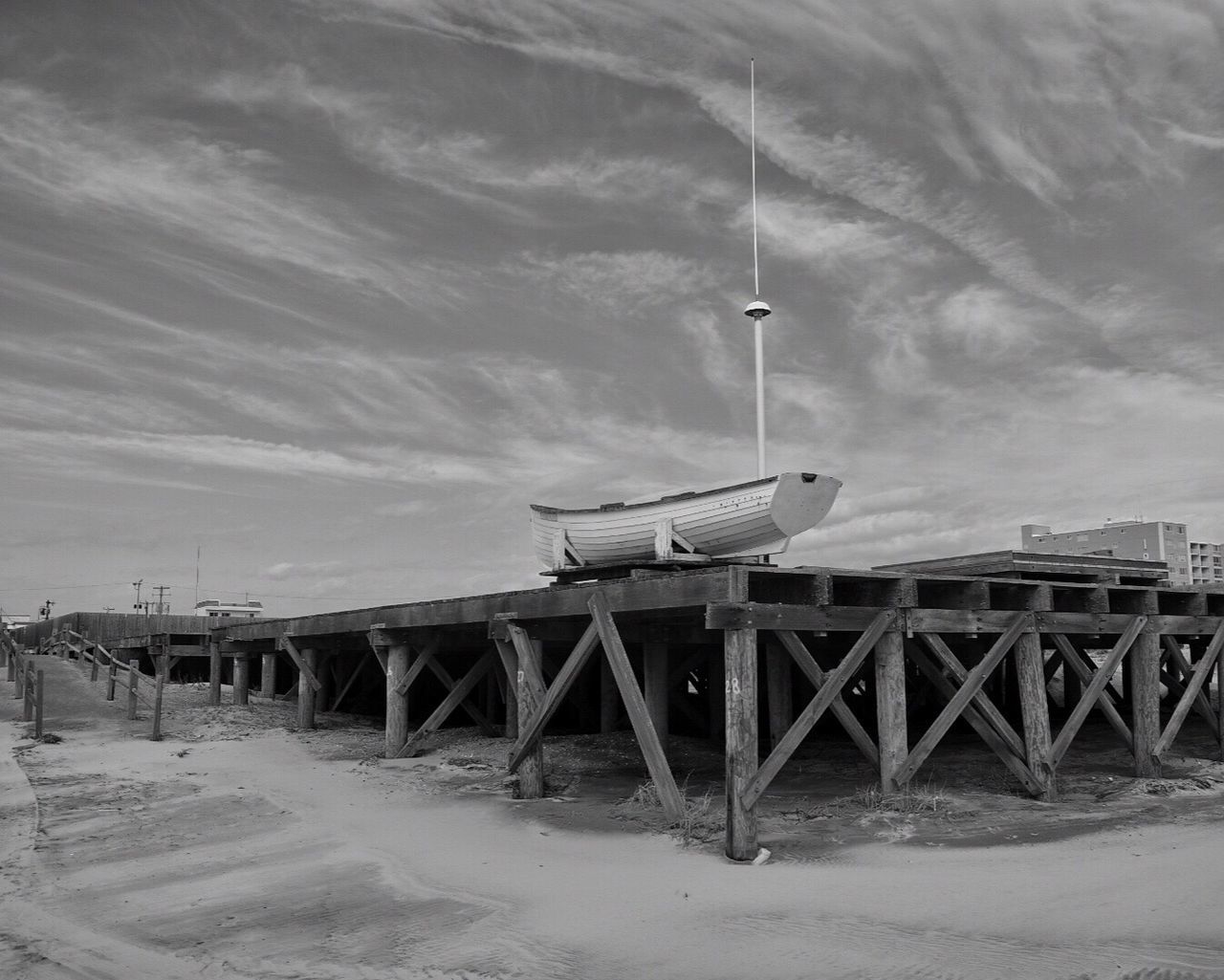 Lifeguard hut on beach against sky